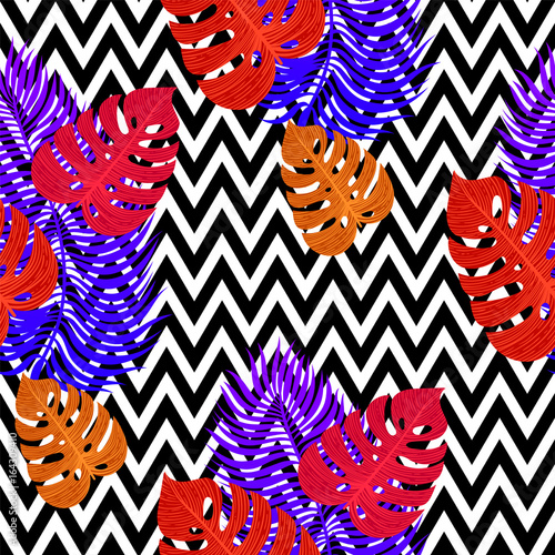 Tropical seamless pattern with exotic vivid leaves on black and white zigzag ...