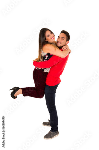 Full portrait of happy couple isolated on white background. Attractive man and woman being playful