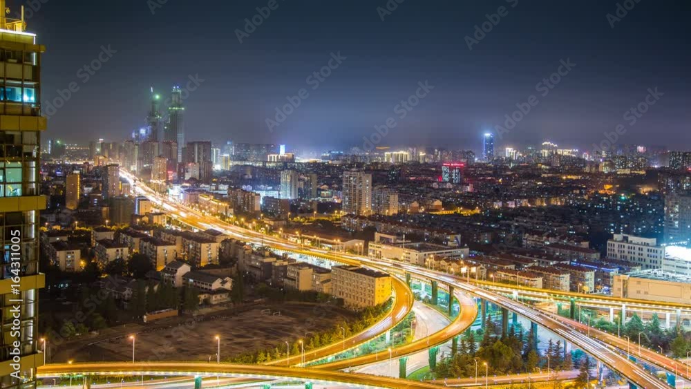 Time lapse of the busy interchange traffic at night in city Time lapse of the busy interchange traffic at night in city