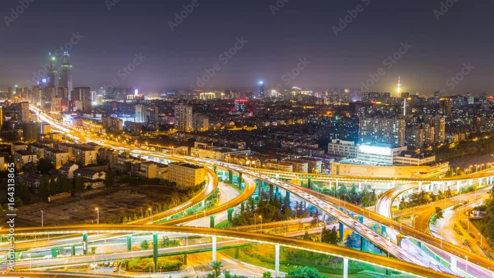 Time lapse of the busy interchange traffic at night in city Time lapse of the busy interchange traffic at night in city