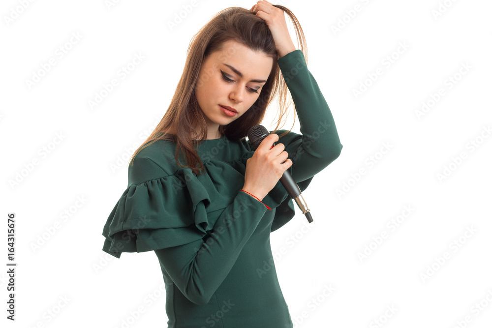 Cutie girl with microphone in green dress Cutie girl with microphone in green dress