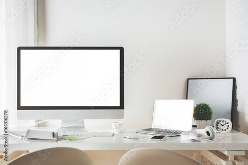 Contemporary desktop with computer and laptop