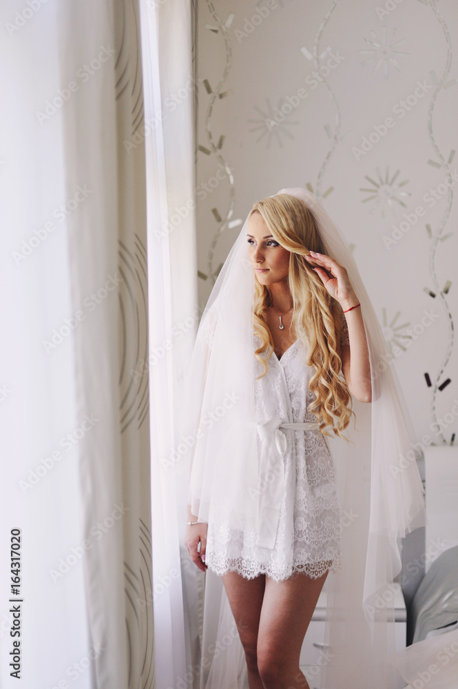 Morning of the young beautiful blonde. The fair-haired bride gathers for a wedding Morning of the young beautiful blonde. The fair-haired bride gathers for a wedding