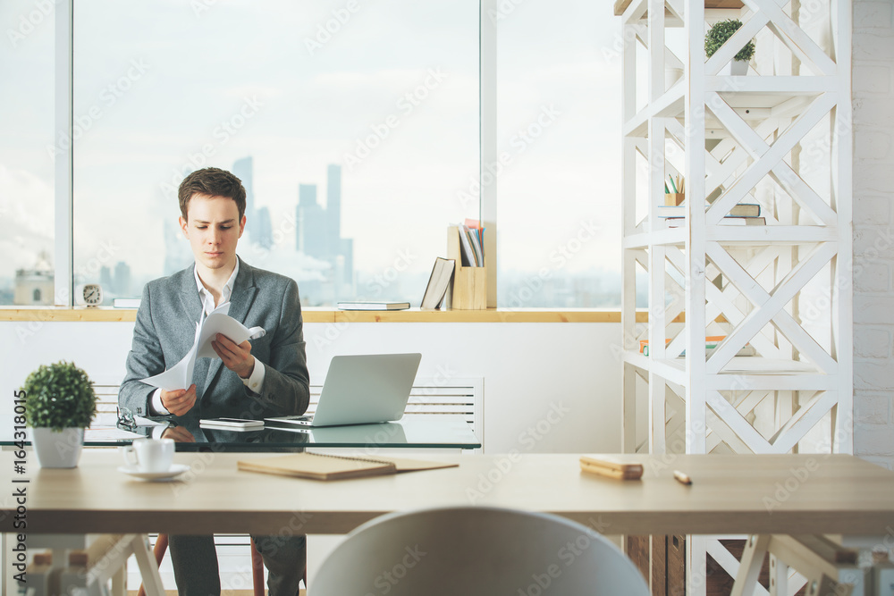 Handsome man working on project Handsome man working on project