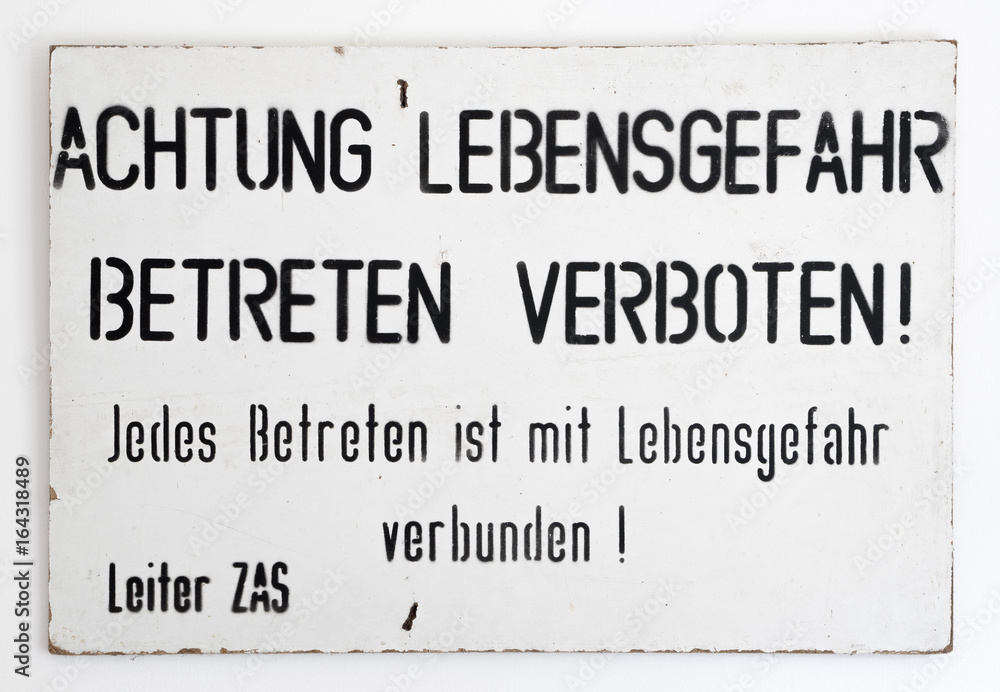 East - West German border warning sign. Found during the reunification of Germany at the end of the Cold War. Translation: Warning danger to life. Entry prohibited. Every ingress is life threatening. East - West German border warning sign. Found during the reunification of Germany at the end of the Cold War. Translation: Warning danger to life. Entry prohibited. Every ingress is life threatening.