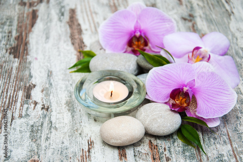 Candle with orchids