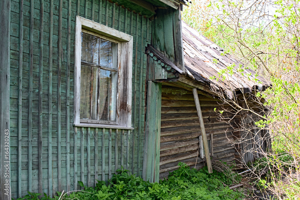 Old dilapidated rustic green house