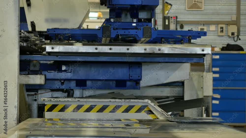 Rotation cnc punching nibbling machine in action metal perforating industrial machine Rotation cnc punching nibbling machine in action metal perforating industrial machine