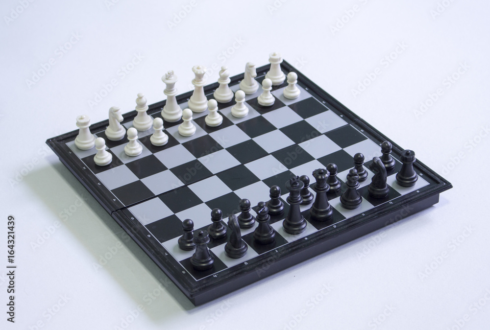 Chess on white background. Table game chess photo. Chess figures position for game start. Chess on white background. Table game chess photo. Chess figures position for game start.