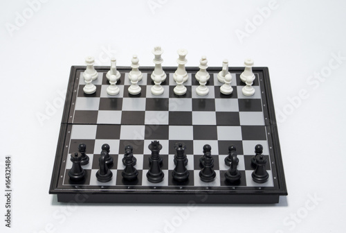 Chess black player side on white background. Table game chess photo.