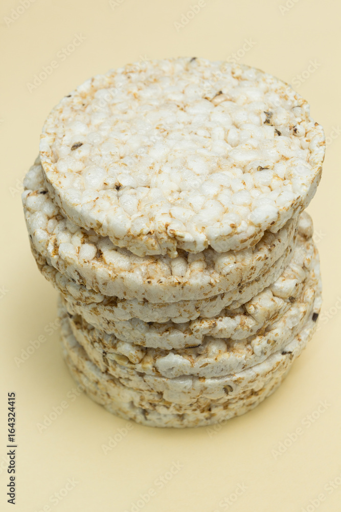 A stack of rice loaves on a brown background. A stack of rice loaves on a brown background.
