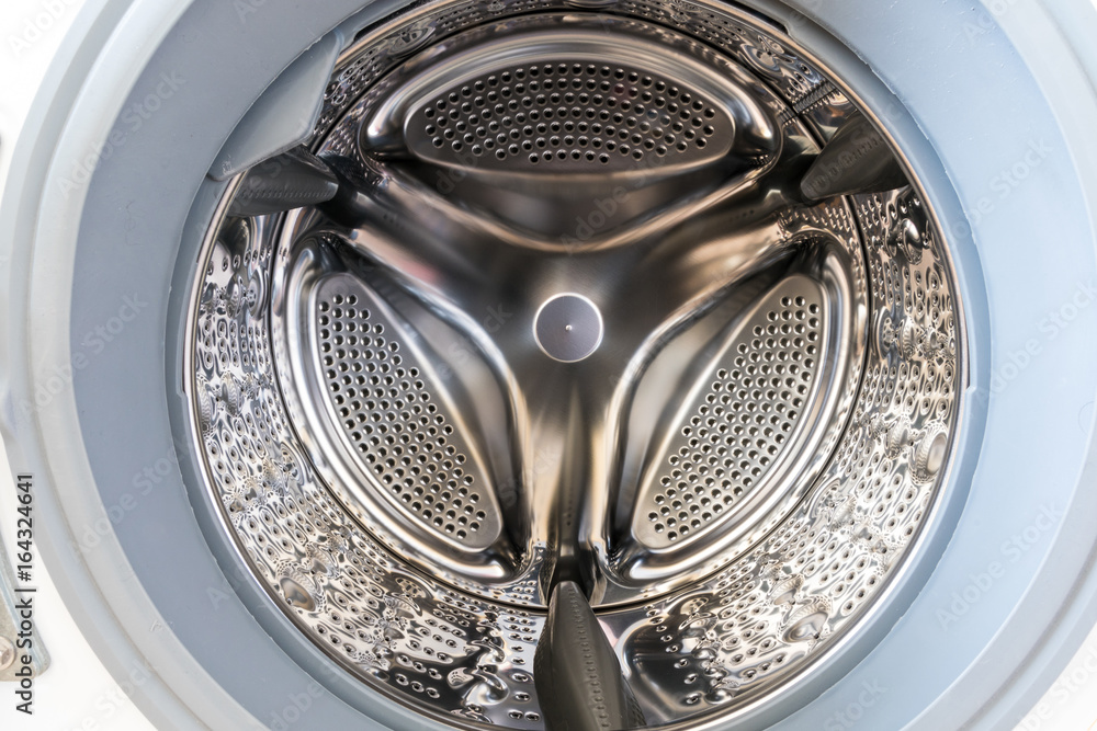 Inside of a washing machine drum Inside of a washing machine drum