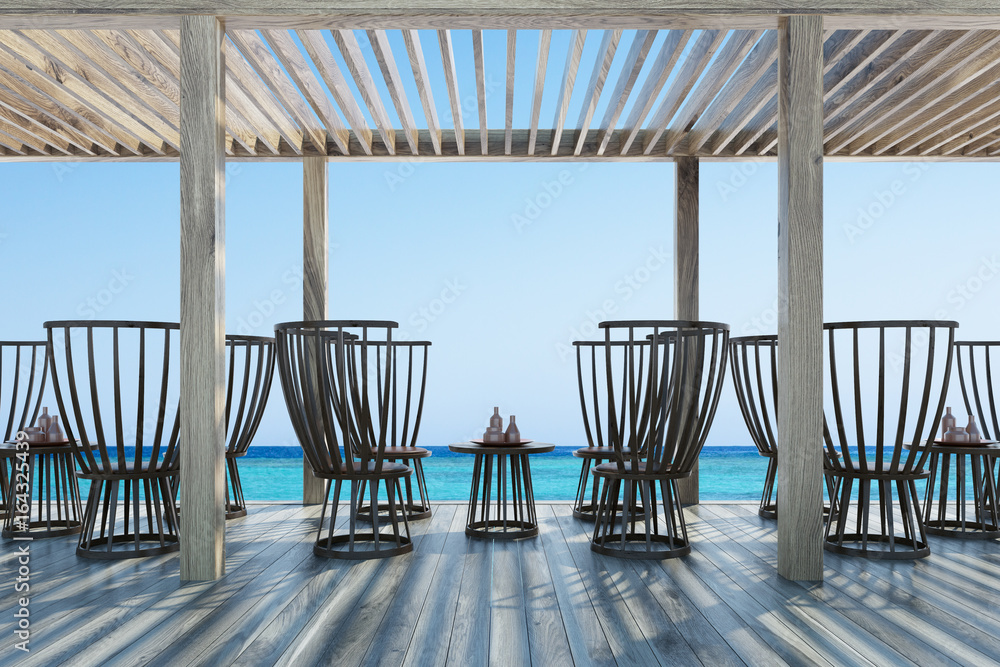 Dark wooden chairs and tables, seaside