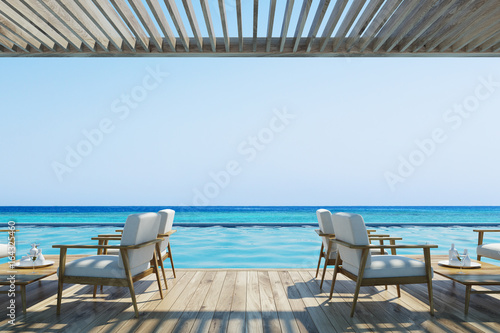 Cafe on a sea shore  white armchairs