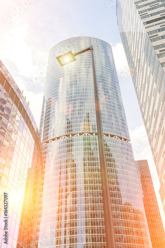 Skyscrapers from glass in the rays of the evening sun