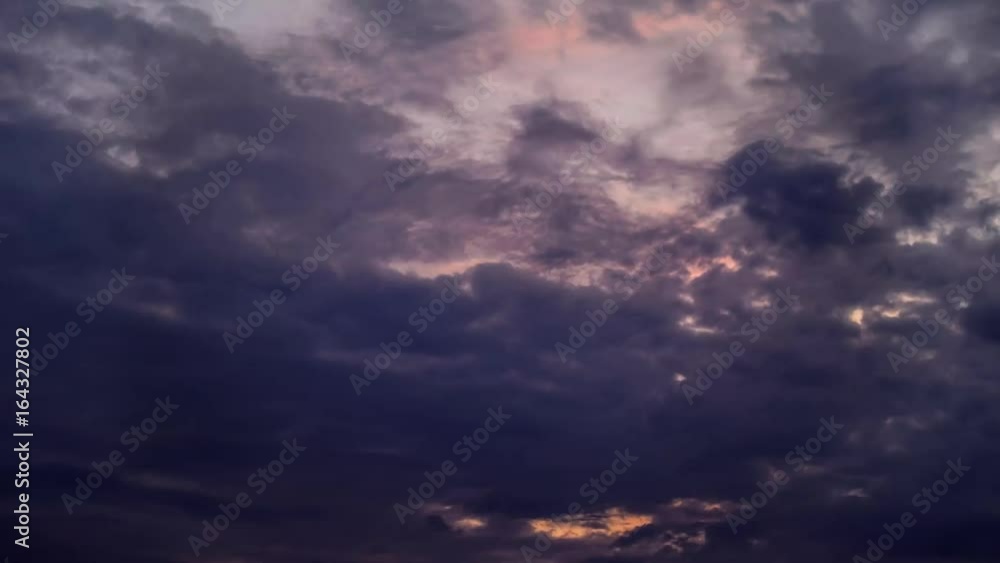 Dark clouds with sunset behind. Dawn hell timelapse cloudes with demonic mood. Sunset moving colors from orange to gray. Dark clouds with sunset behind. Dawn hell timelapse cloudes with demonic mood. Sunset moving colors from orange to gray.