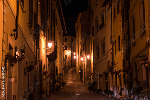 Night view of a street in the historic center of Massa Marittima in the province of Grosseto in Tuscany