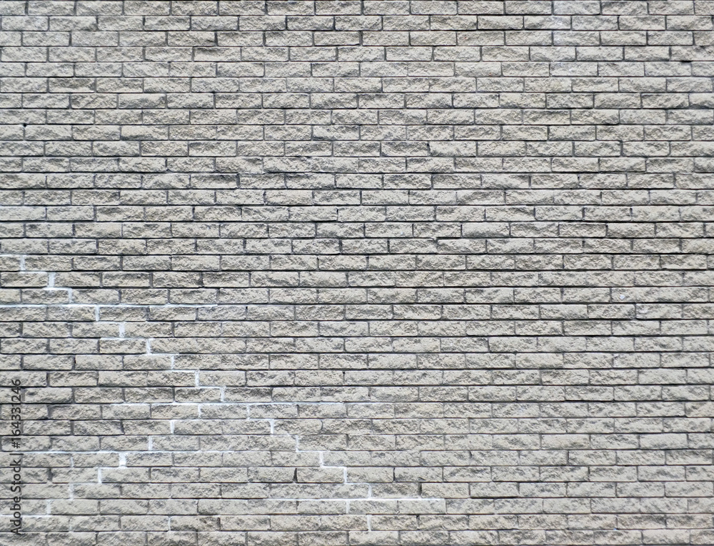 Obraz premium white brick wall background with cracks and repairs repeating pattern