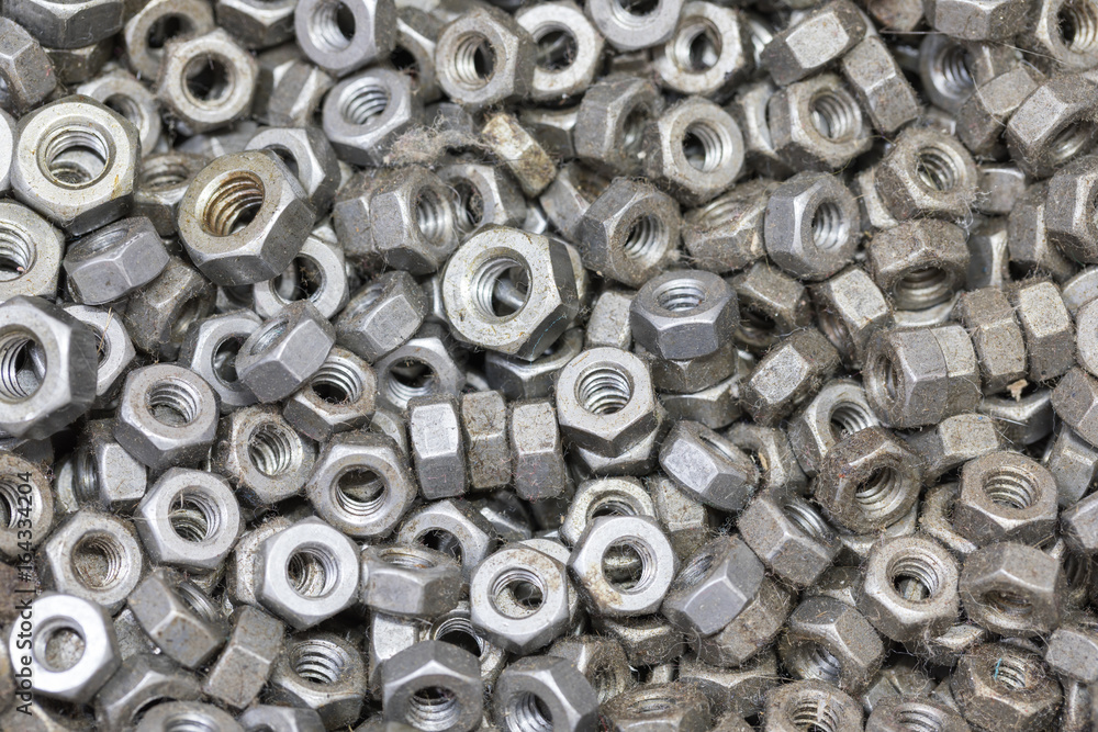 Heap of Metal Screw Steel Nuts texture background Heap of Metal Screw Steel Nuts texture background