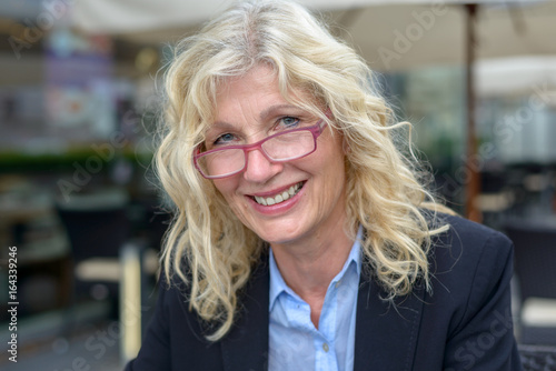 Photography Middle-aged businesswoman smiling into the camera