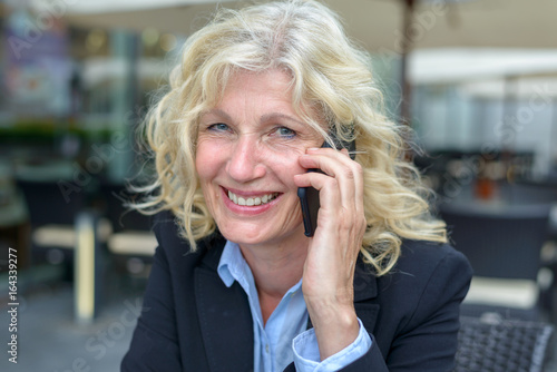 Middle-aged businesswoman talking on a mobile
