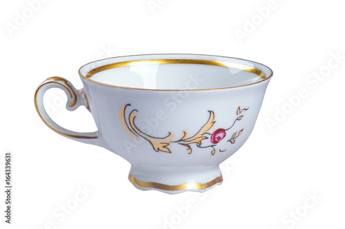 Empty vintage tea (coffee) faience cup. Isolated on white photo