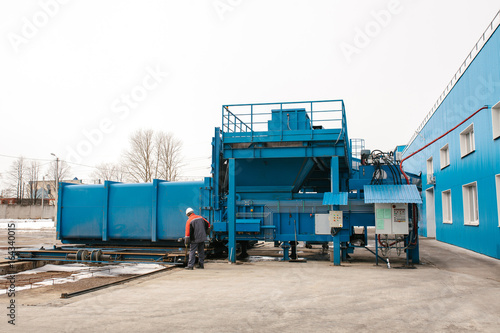 Preparation of a container with waste for subsequent transportation to a waste disposal plant. Waste processing plant. Business for waste sorting and processing.