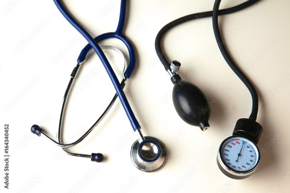 Blood pressure meter and stethoscope, isolated on white Blood pressure meter and stethoscope, isolated on white
