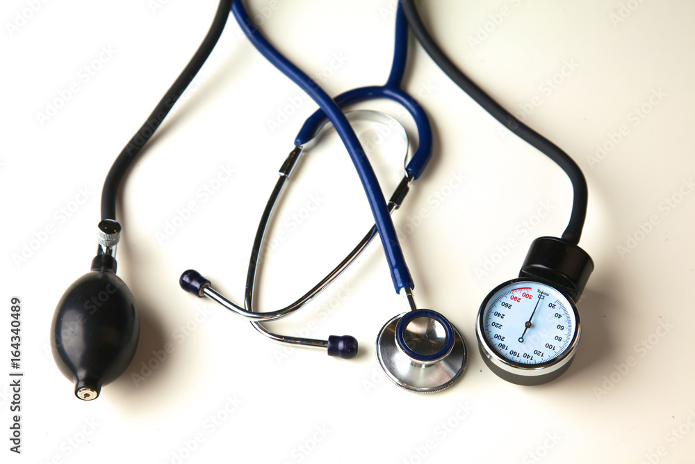Blood pressure meter and stethoscope, isolated on white Blood pressure meter and stethoscope, isolated on white