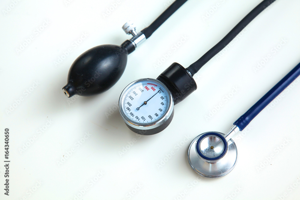 Blood pressure meter and stethoscope, isolated on white Blood pressure meter and stethoscope, isolated on white