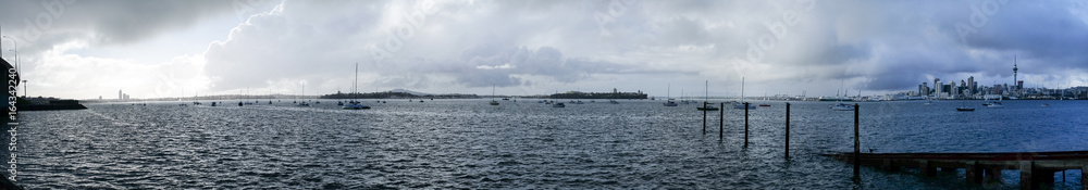 Stormy grey cloudy sky over Auckland and Waitemata Harbour in winter Stormy grey cloudy sky over Auckland and Waitemata Harbour in winter