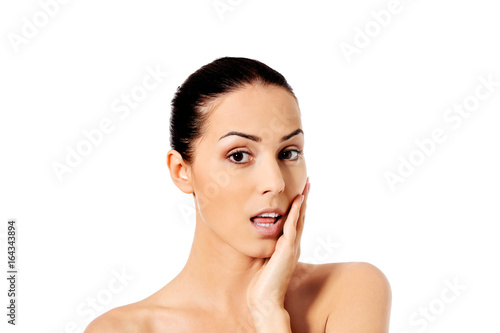 Beautiful woman face close up studio. Isolated on white.