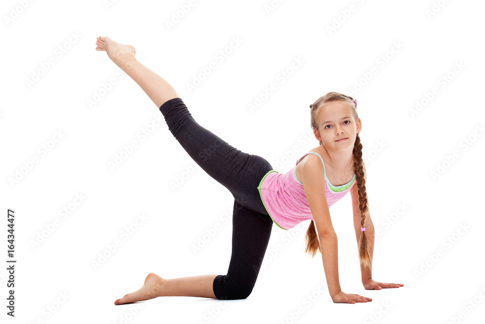 Young girl doing gymnastic exercises