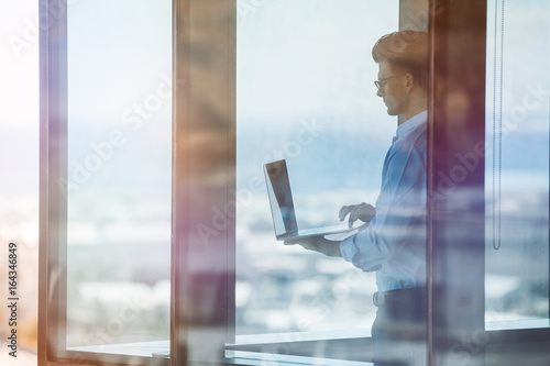 Photography Businessman inside office building and working on laptop