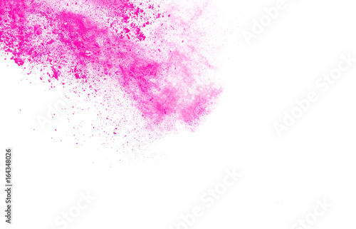 abstract pink-purple powder splatted on white background Freeze motion of pink-purple powder exploding on white background.