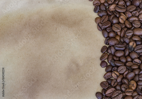 Coffee beans on a vintage paper background © EdVal