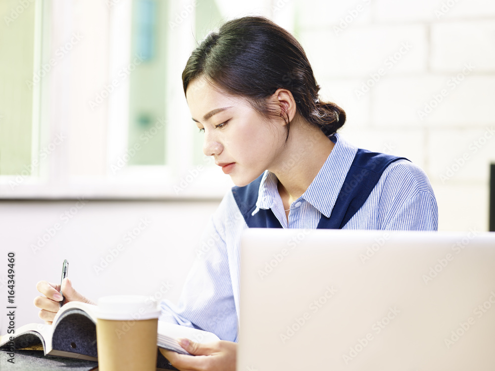 young asian business woman working in office young asian business woman working in office