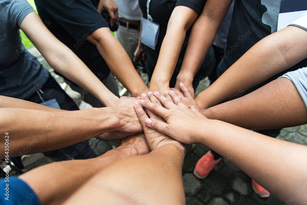 Group of people United Hands to built teamwork together with Spirit - teamwork concepts,teamwork