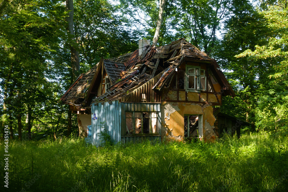 Abandoned broken house in the wood Abandoned broken house in the wood