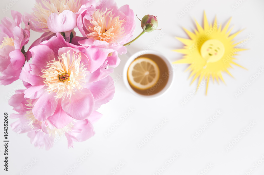 Bouquet of peonies, tea with lemon, notebook , photo in gentle colors. Good morning. Have a nice day! Place for text
Bouquet of peonies, tea with lemon, notebook , photo in gentle colors. Good morning. Have a nice day! Place for text