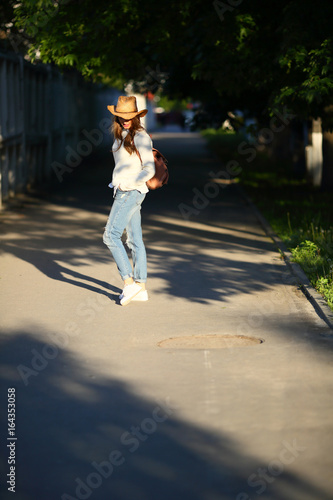 Walking woman sidewalk outdoor, casual style clothes