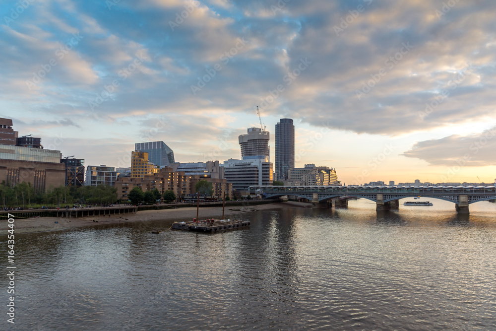 Amazing sunset Cityscape from Millennium Bridge and Thames River, London, Great Britain