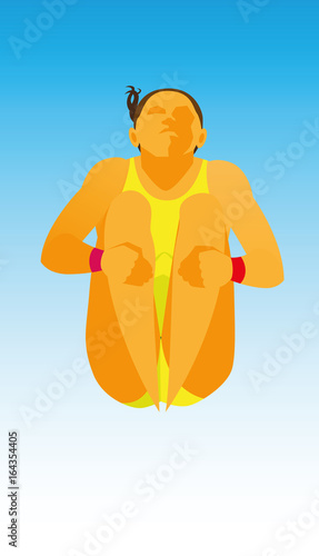 A young woman is a dive jumper in the water that performs a somersault