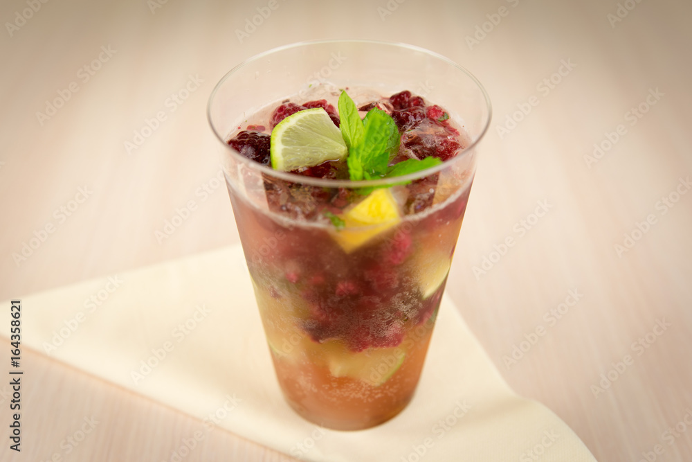 Raspberry lemonade with mint on wooden table Raspberry lemonade with mint on wooden table