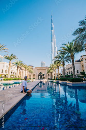 Boy resting near the water in Dubai