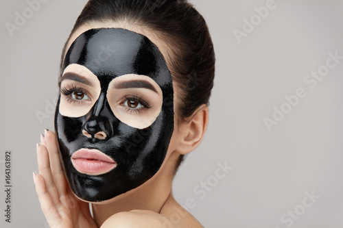 Female Beauty Face Skin Masking. Girl With Black Peeling Mask