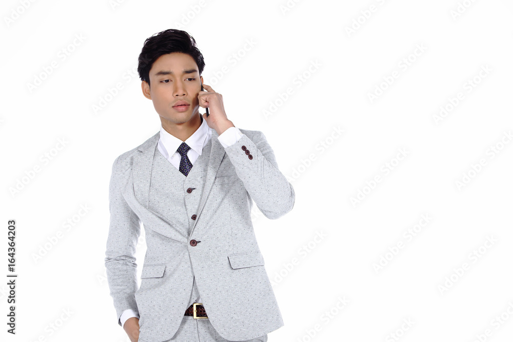 Gray Dot Suit Pant Businessman, Tan skin man half body talk to someone in mobile smart phone feeling expression, studio lighting white background isolated copy space Gray Dot Suit Pant Businessman, Tan skin man half body talk to someone in mobile smart phone feeling expression, studio lighting white background isolated copy space