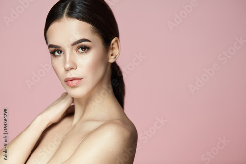 Woman Body Skin Care. Beautiful Female On Pink Background