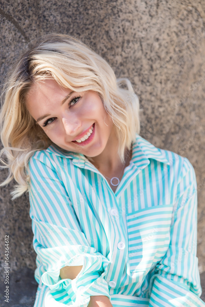 young blond woman look and smile