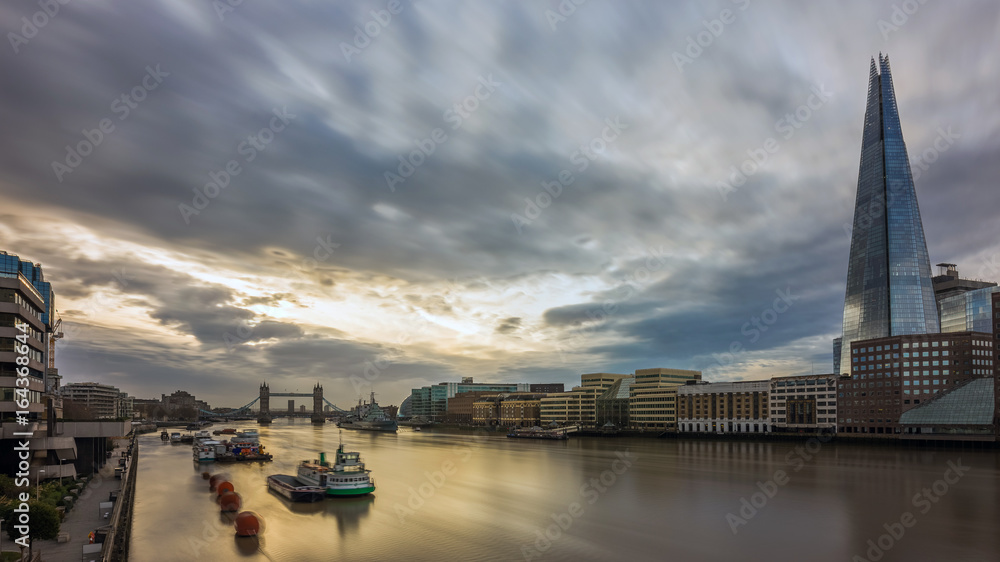 London, England - Panoramic skyline view of London at sunrise with Tower Bridge and skyscrapers